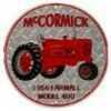 Open Road Brands Emb Tin Sign Mccormick Tractor Rnd 12"x12"